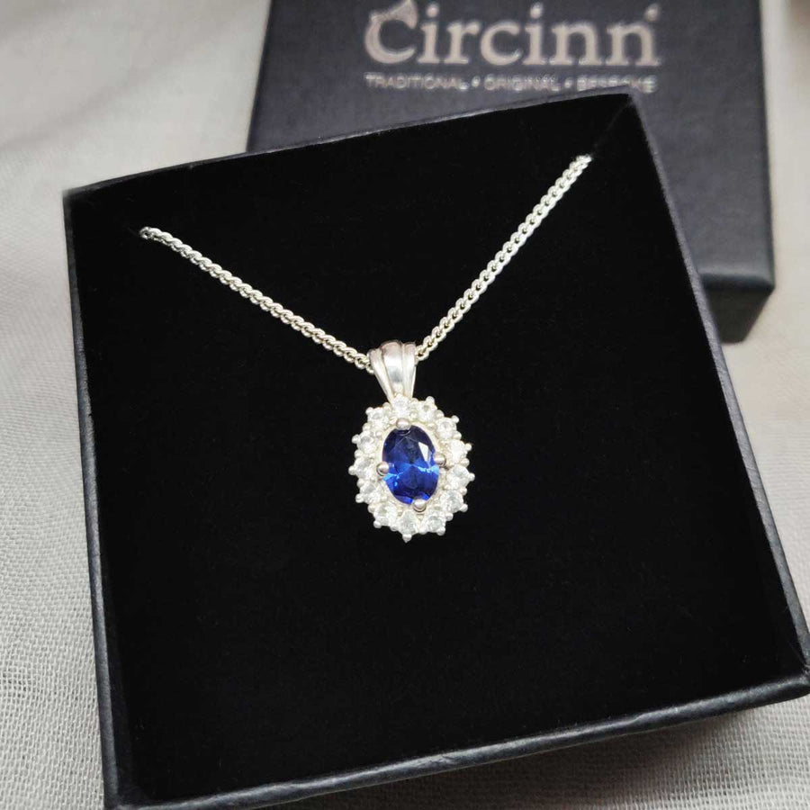 Blue and white sapphire cluster necklace in argentium silver in branded box