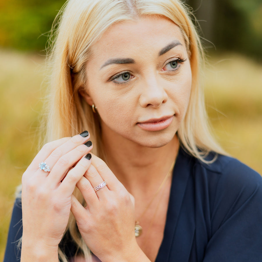 Ladies Triquetra Pattern Celtic Knot Wedding Ring on a model&#39;s hand.