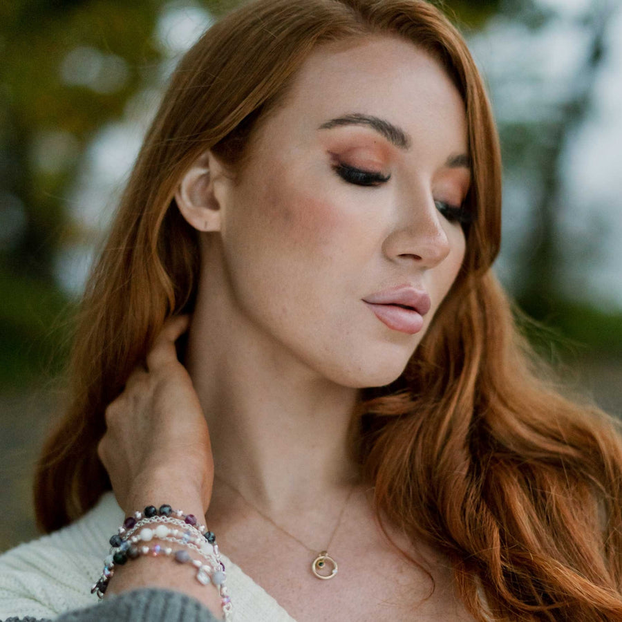 Gold solasta necklace being worn.