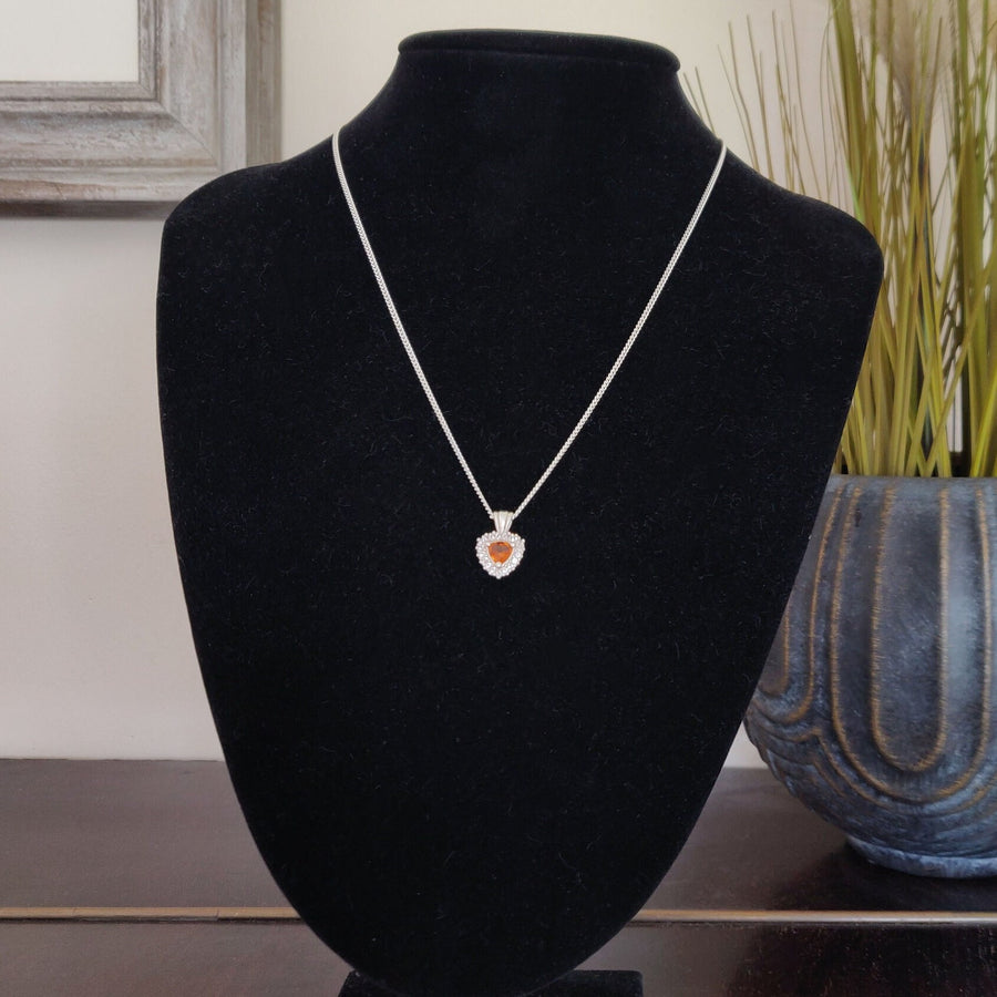 Argentium Sterling Silver Citrine and Sapphire Cluster Necklace on a display bust.