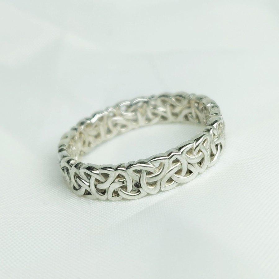 Ladies Triquetra Pattern Celtic Knot Wedding Ring on a white background.