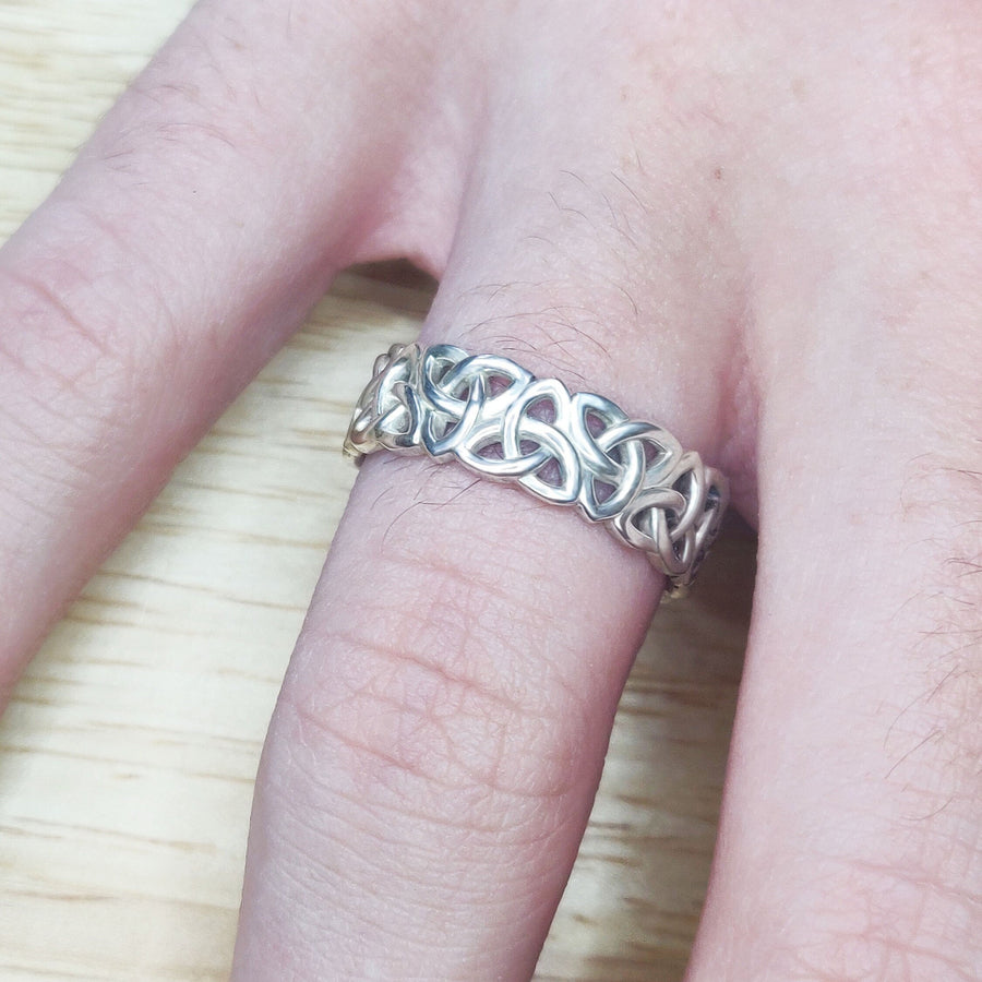 Gents Triquetra Celtic Knot Viking Wedding Ring on a hand.