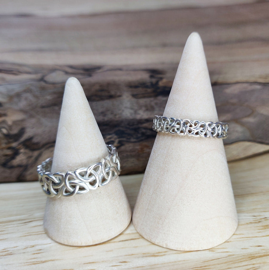 Ladies and Gents Triquetra Celtic Knot Viking Wedding Ring on Wooden Cones