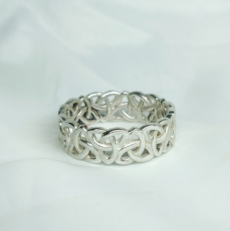 Gents Triquetra Celtic Knot Viking Wedding Ring on a White Background.