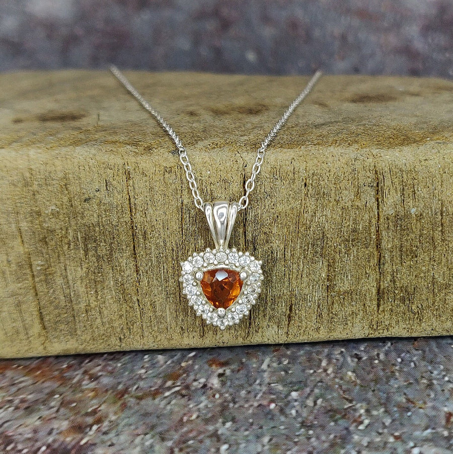 Argentium Citrine and Sapphire Cluster Necklace on a wooden block