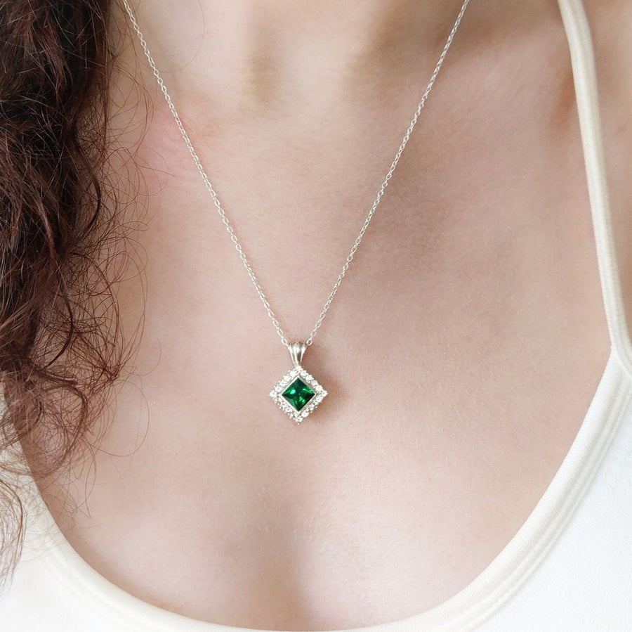 Princess Emerald and Diamond Cluster Necklace being worn