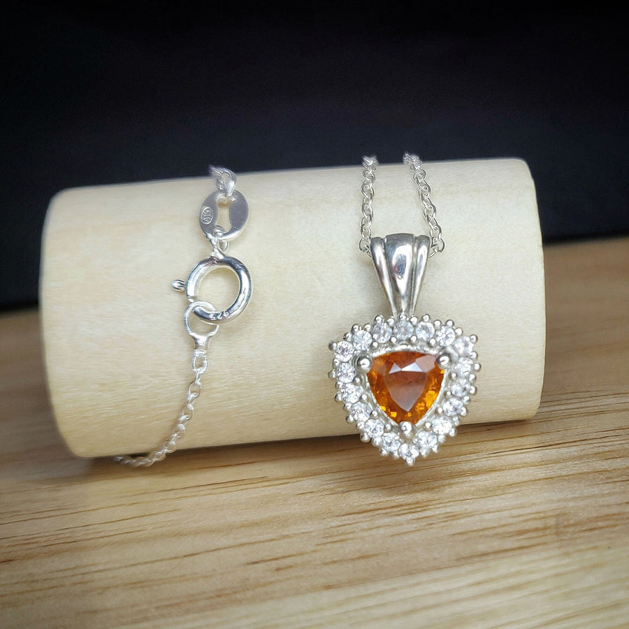 Argentium Silver Citrine and Sapphire Cluster Necklace on a wooden display block