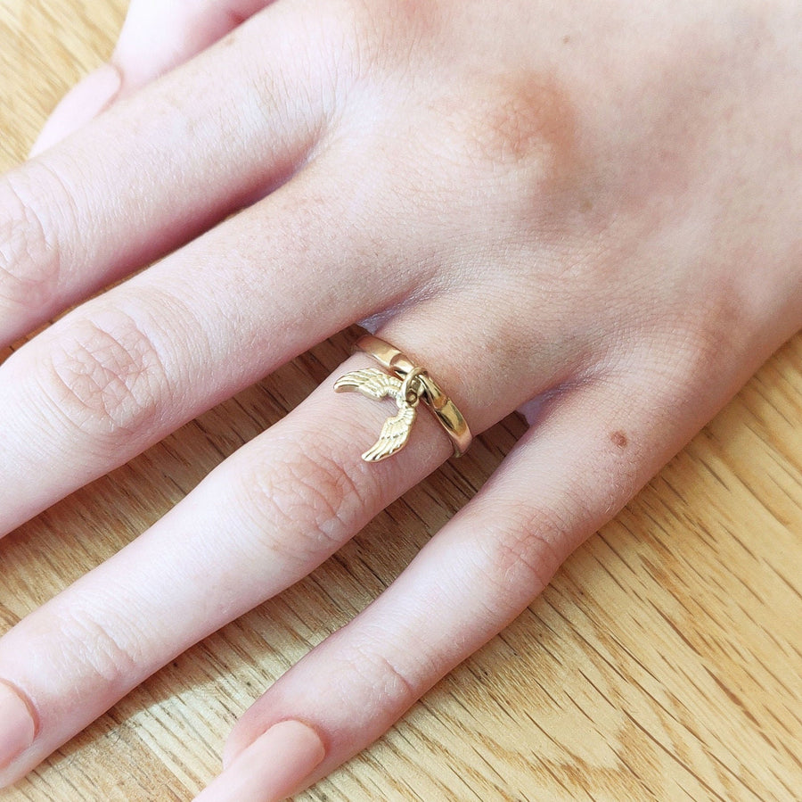 Gold Angel Wings Ring being worn