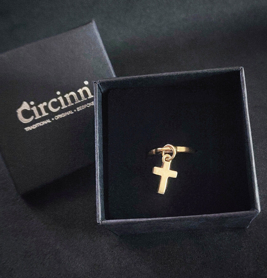Solid gold cross dangle ring in a branded circinn box