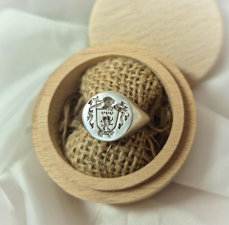 family crest ring in argentium sterling silver in a display box