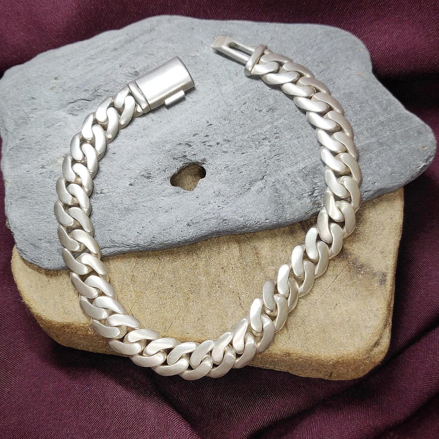 argentium silver cuban bracelet on a block