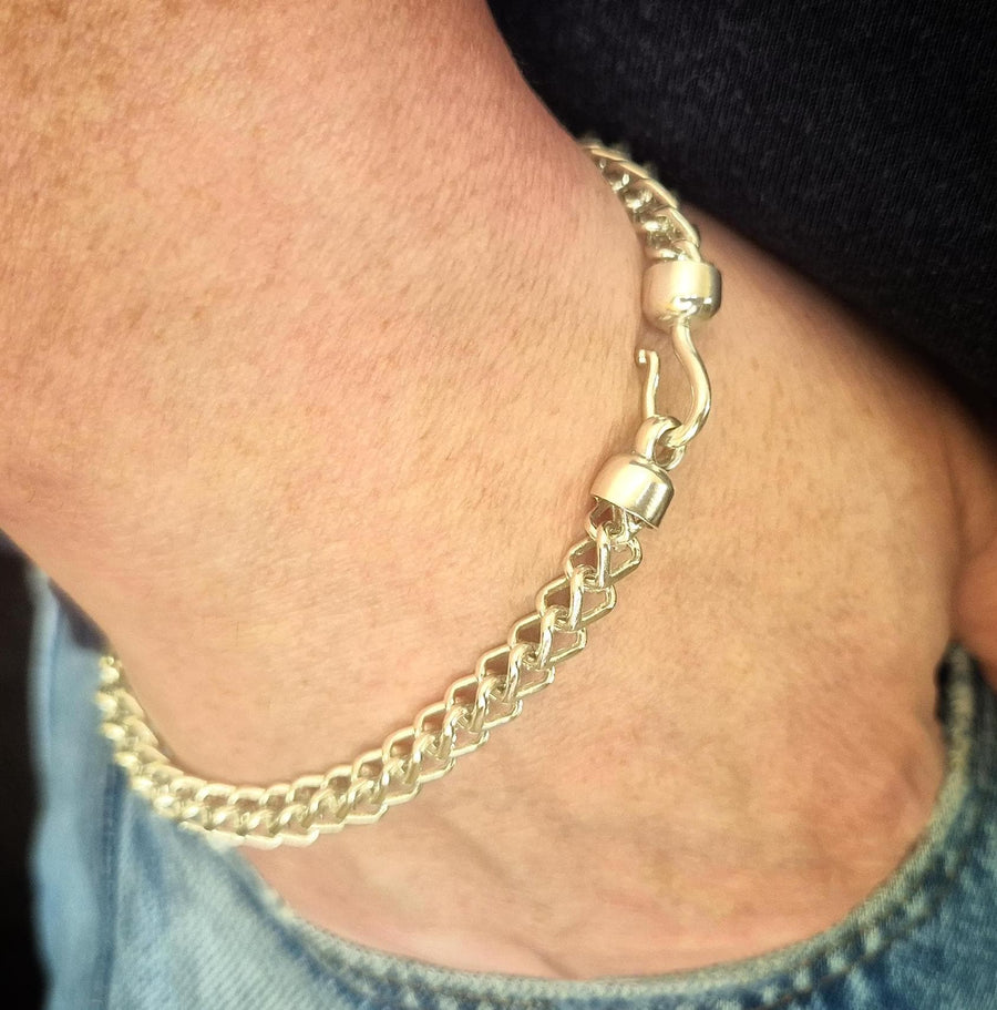 double cross bracelet being worn with pirate hook fixture showing.