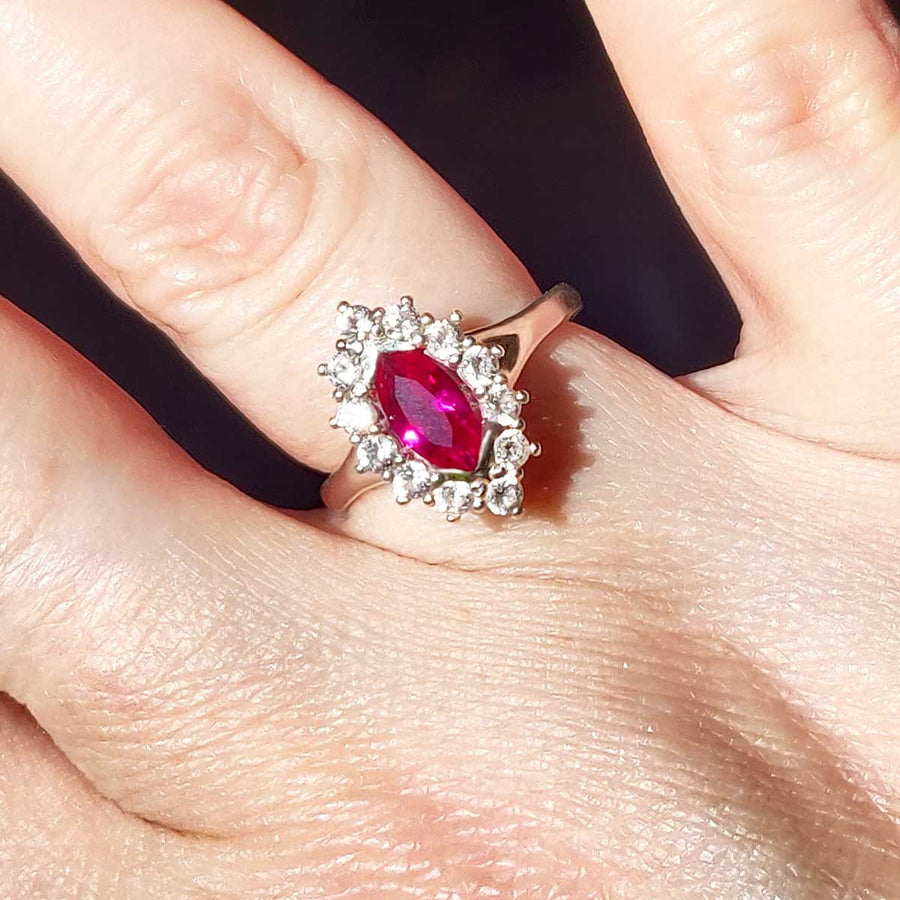 Ruby Marquise and white sapphire cluster ring in argentium silver worn on finger