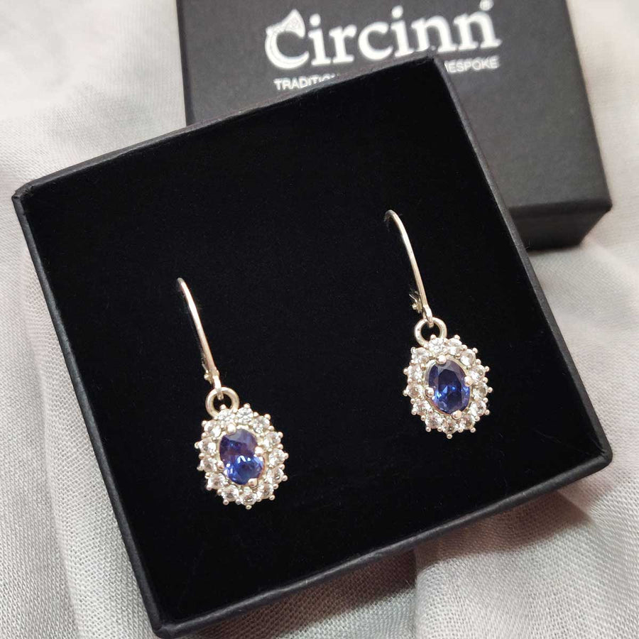 Blue and white sapphire earrings in argentium silver in a branded box