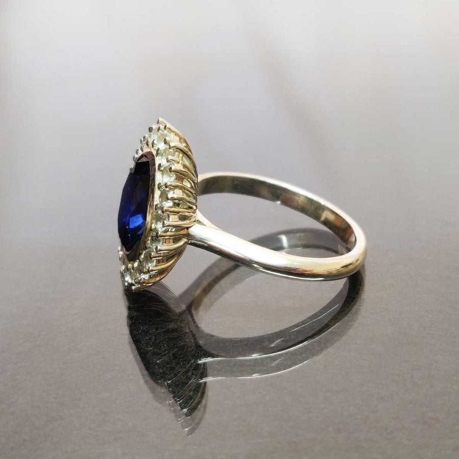 Blue and white sapphire cluster ring in argentium silver from side