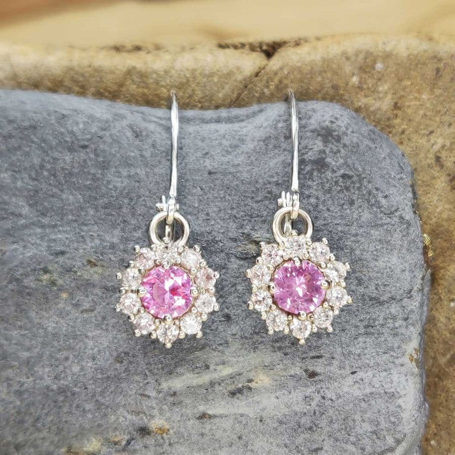 Pink and white sapphire cluster earrings in argentium silver on slate background
