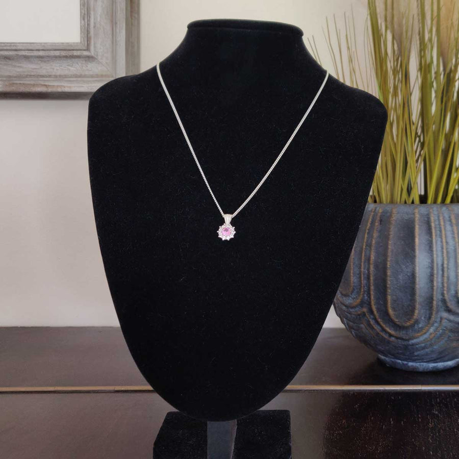 Pink and white sapphire cluster necklace in argentium silver on black bust