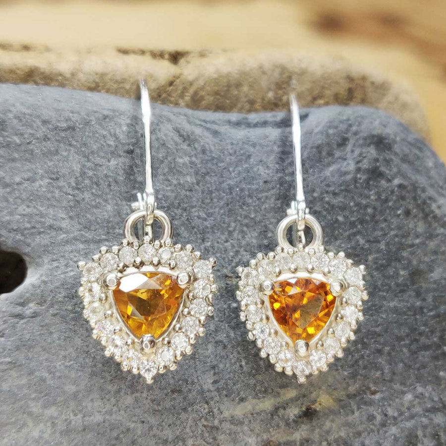 Trillion cut citrine and white sapphire cluster earrings in argentium silver on slate background