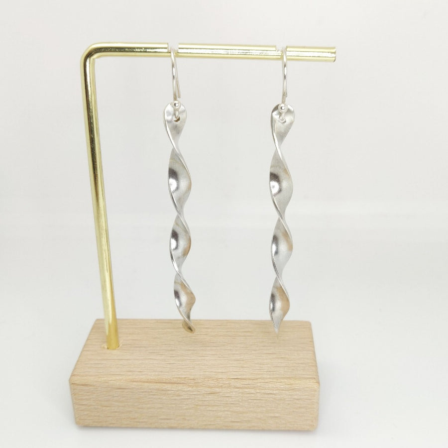 Argentium Silver Twist Earrings on a brass stand.