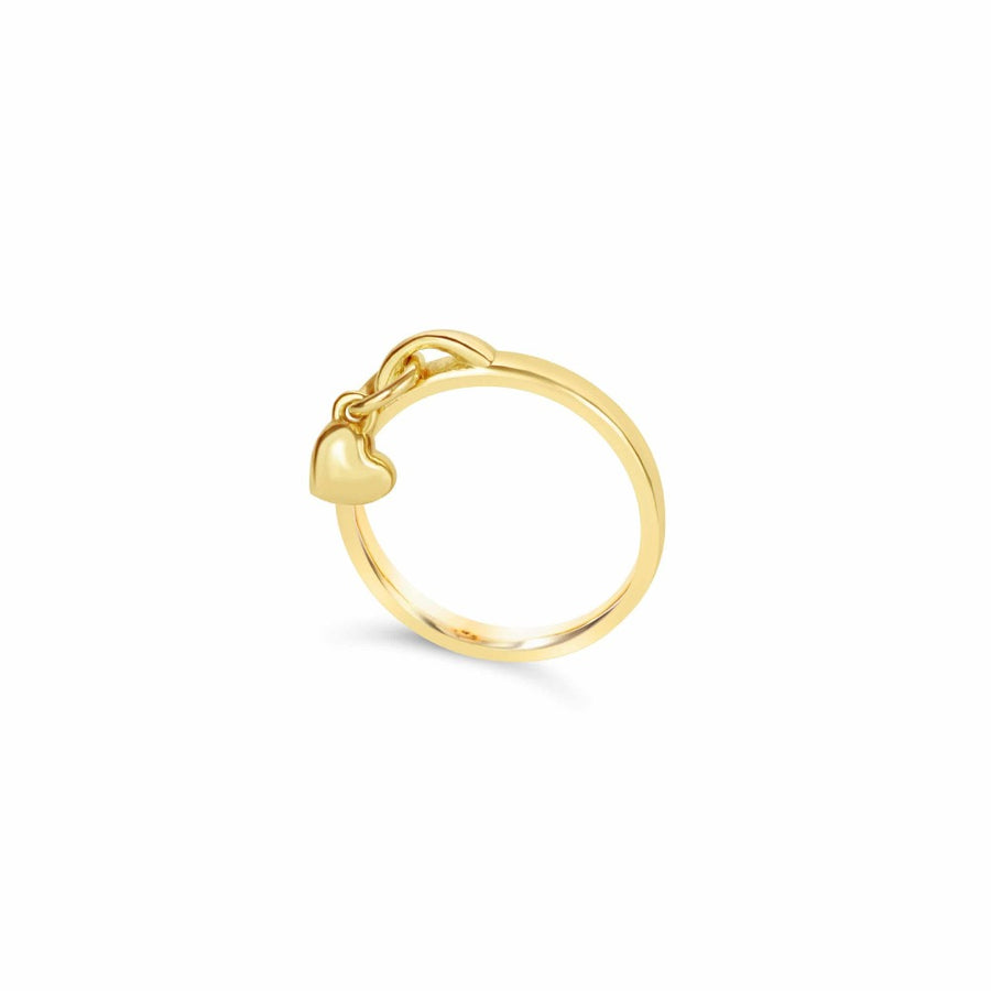 Gold drop ring with gold heart charm on white background