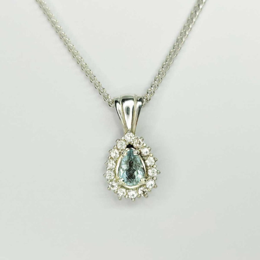 Pear cut aquamarine cluster necklace in argentium silver on white background