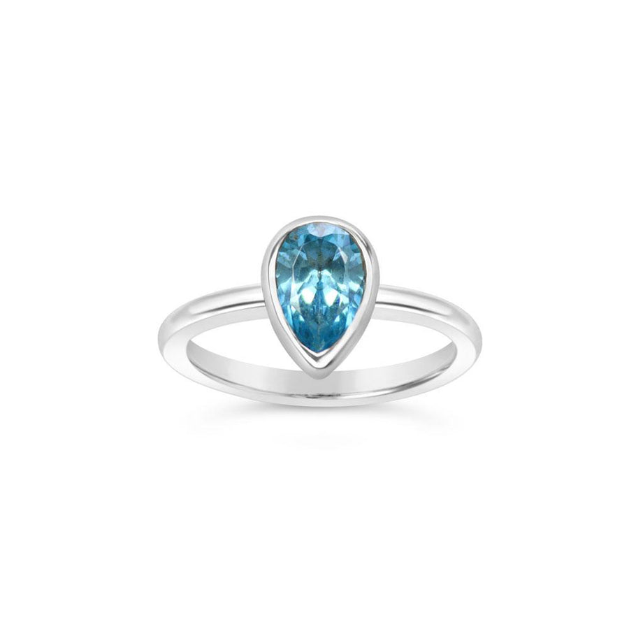 Pear cut topaz ring in argentium silver on white background