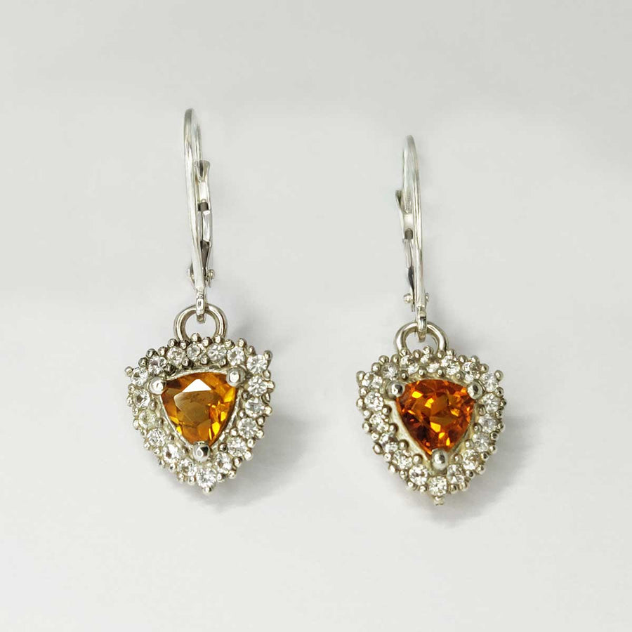 Trillion cut citrine and white sapphire cluster earrings in argentium silver on white background