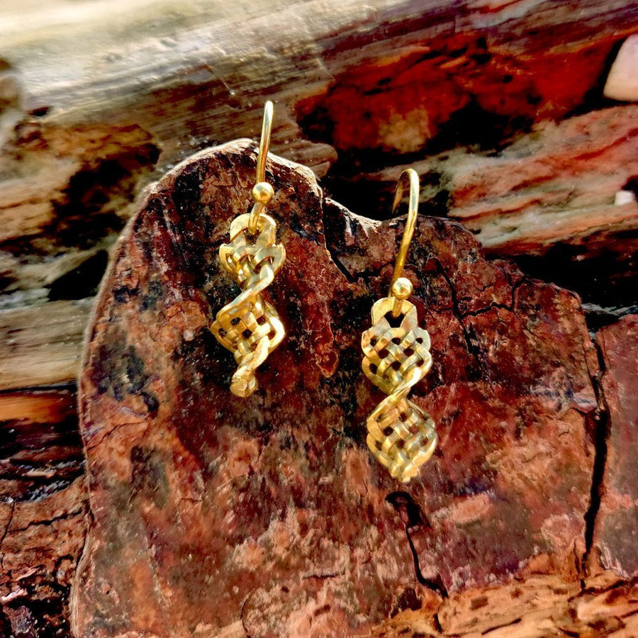 gold dirk handle twist celtic knot earrings on beach