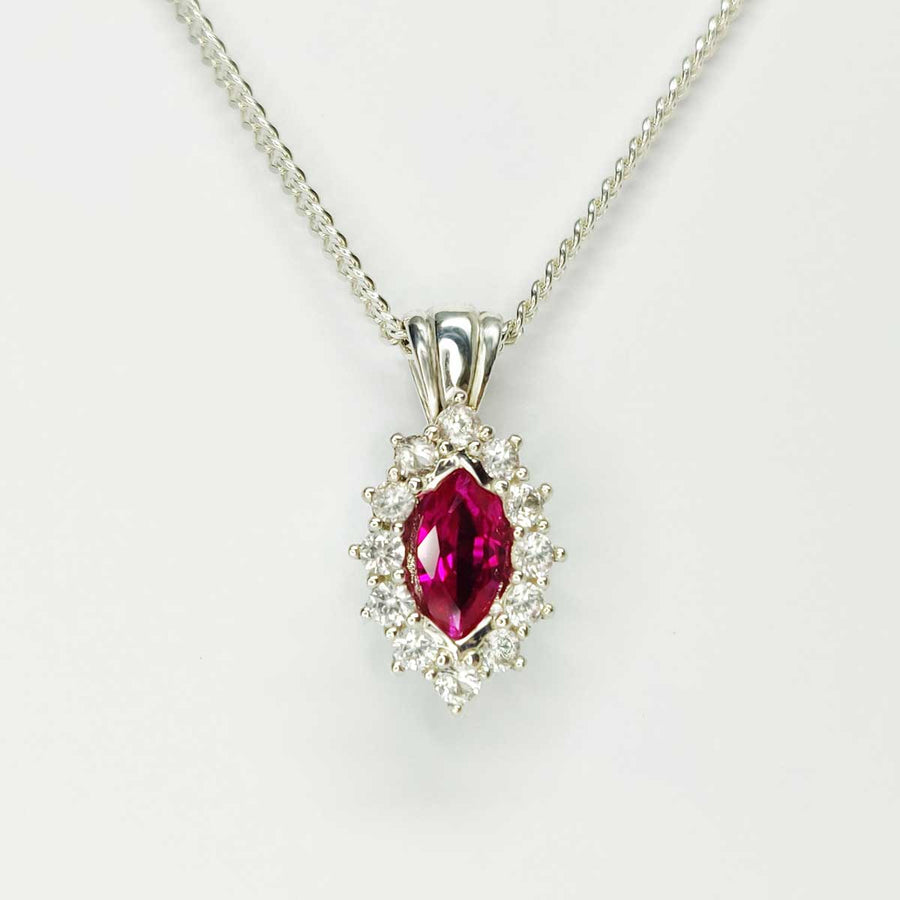 Ruby Marquise and white sapphire cluster necklace in argentium silver on white background