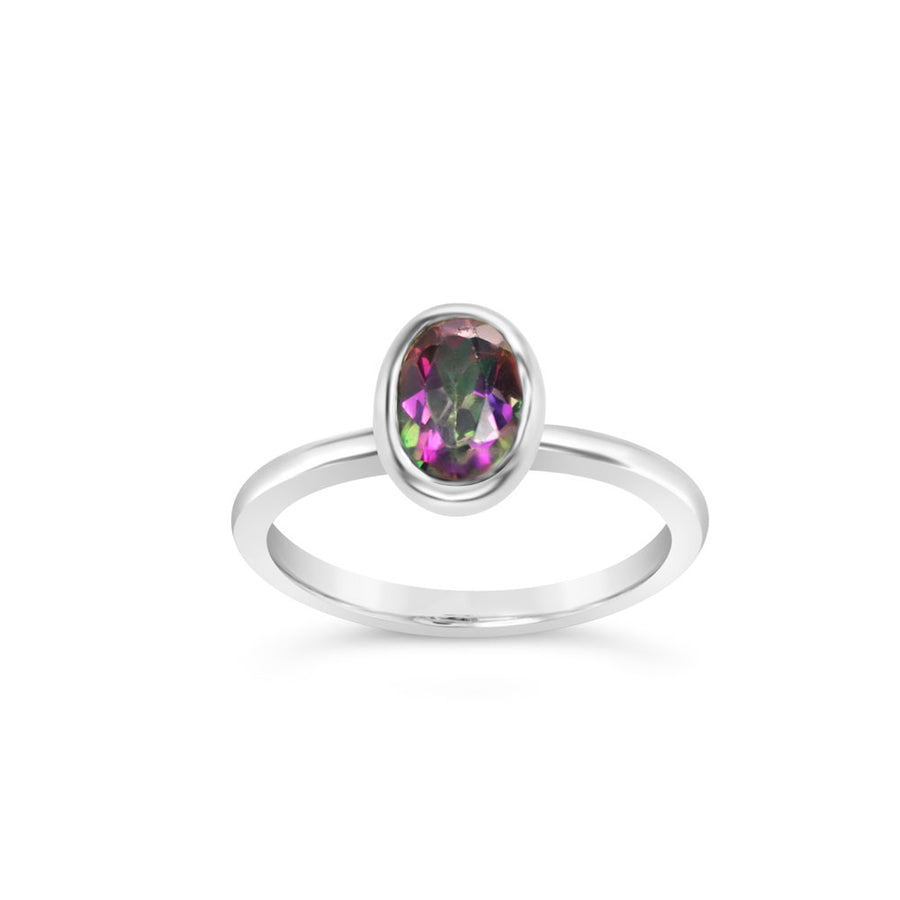 Mystic topaz oval ring in argentium silver on a white background